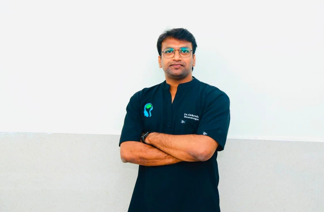 Dr. GRK Reddy in surgical scrubs at Suraksha Hospital